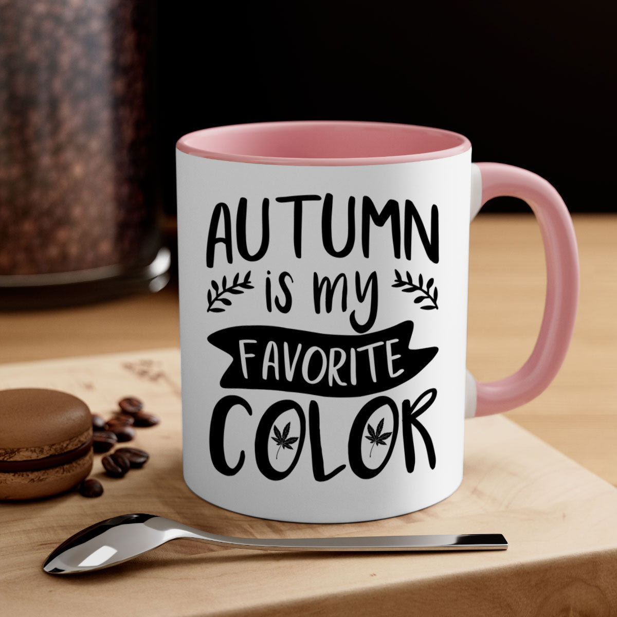 A two-tone ceramic coffee mug featuring the phrase 'Autumn is My Favorite Color' with a glossy finish and a colored handle, available in multiple colors.