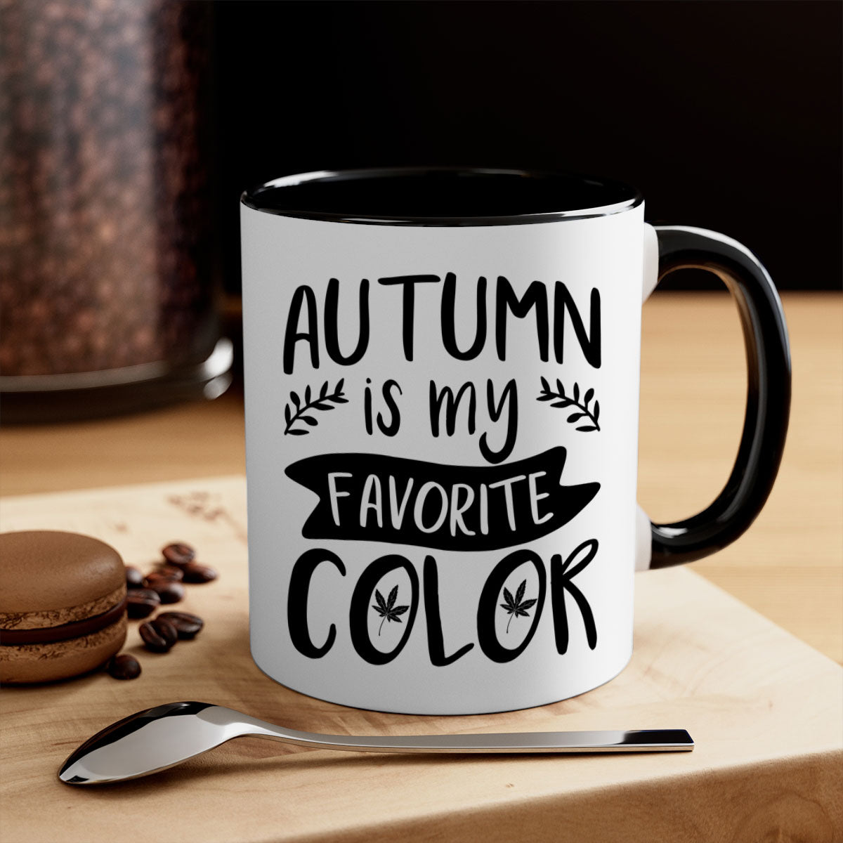 A two-tone ceramic coffee mug featuring the phrase 'Autumn is My Favorite Color' with a glossy finish and a colored handle, available in multiple colors.