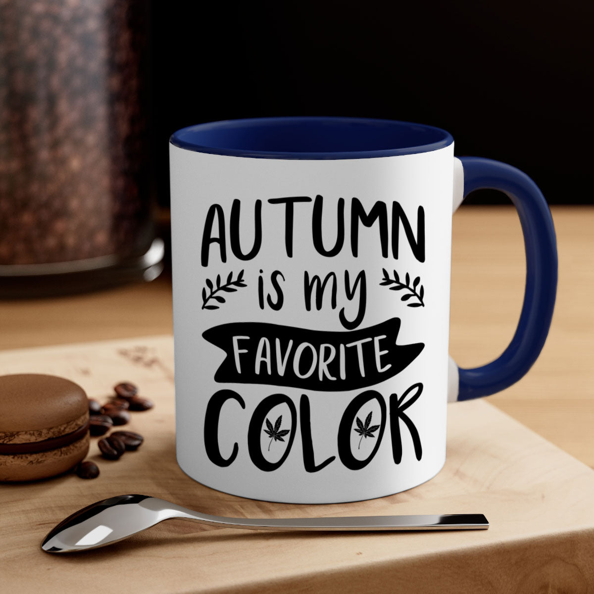 A two-tone ceramic coffee mug featuring the phrase 'Autumn is My Favorite Color' with a glossy finish and a colored handle, available in multiple colors.