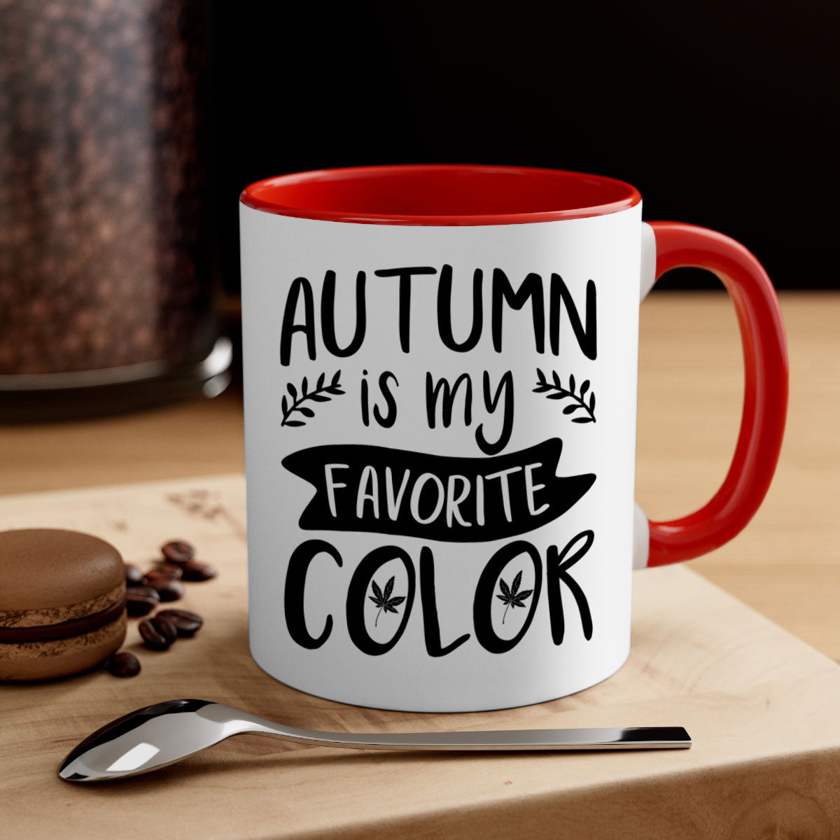 A two-tone ceramic coffee mug featuring the phrase 'Autumn is My Favorite Color' with a glossy finish and a colored handle, available in multiple colors.