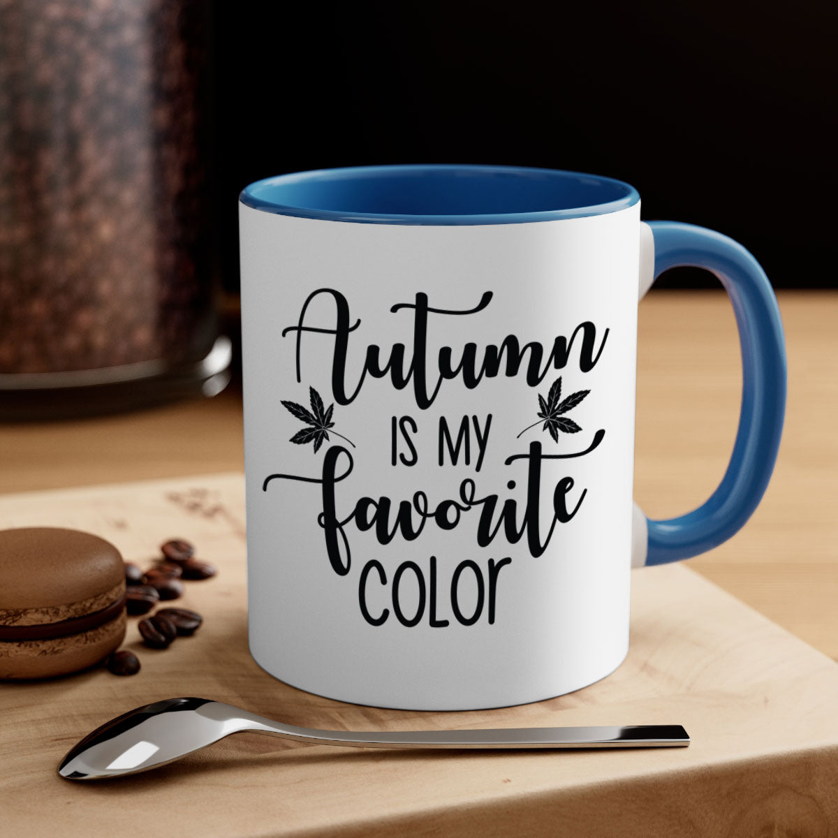 A stylish two-tone ceramic mug with a colored handle and glossy finish, showcasing the phrase 'Autumn Is My Favorite Color'.