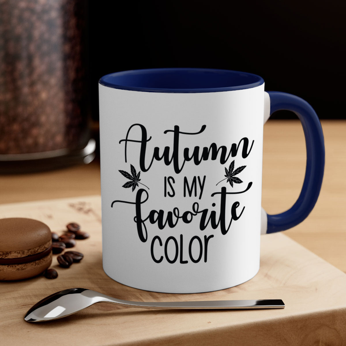 A stylish two-tone ceramic mug with a colored handle and glossy finish, showcasing the phrase 'Autumn Is My Favorite Color'.