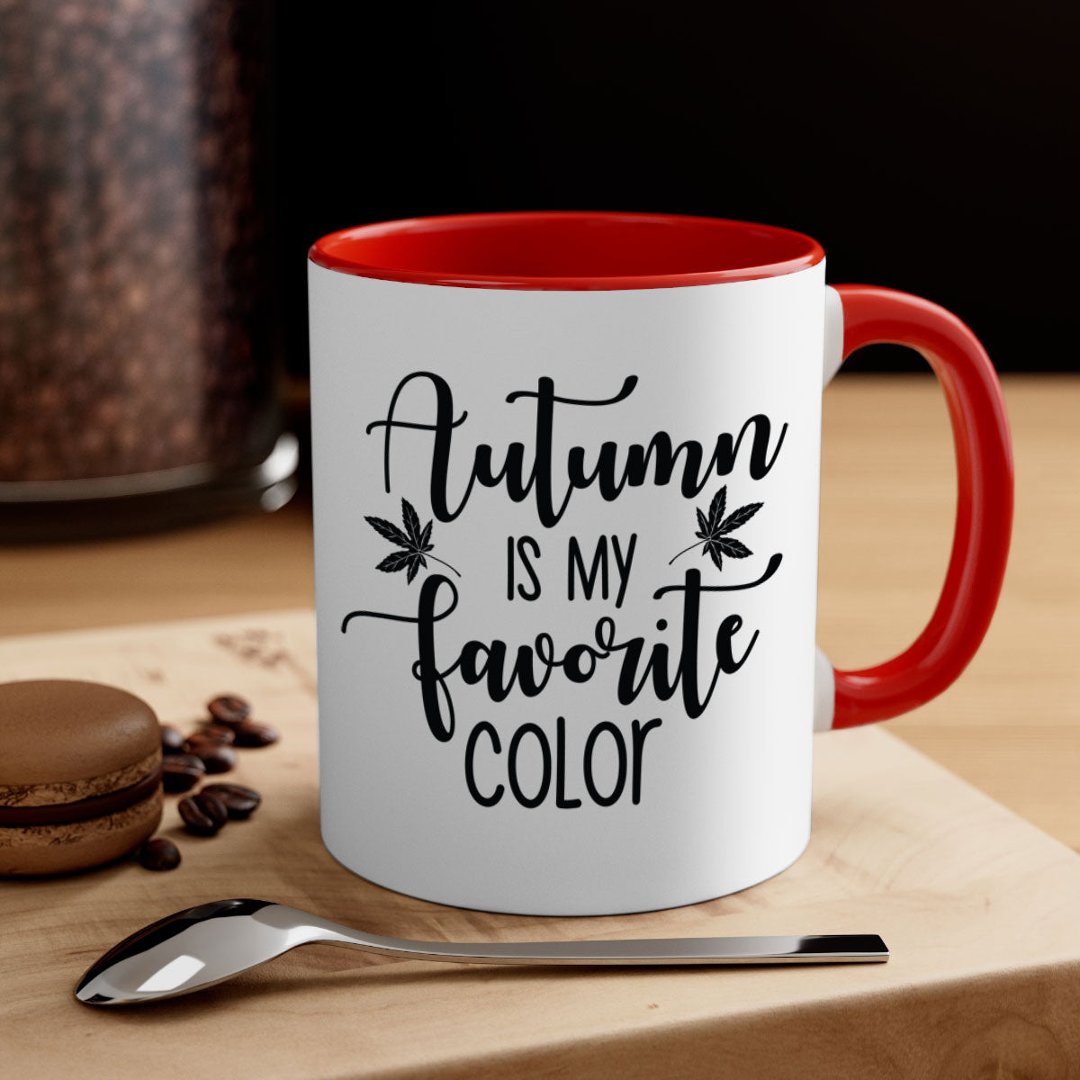 A stylish two-tone ceramic mug with a colored handle and glossy finish, showcasing the phrase 'Autumn Is My Favorite Color'.