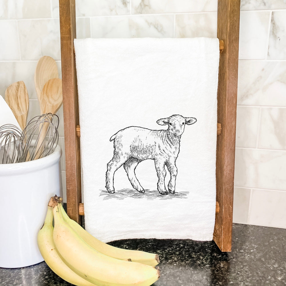 A vibrant Baby Lamb Cotton Tea Towel featuring a charming lamb design, made from 100% absorbent cotton, perfect for kitchen use.