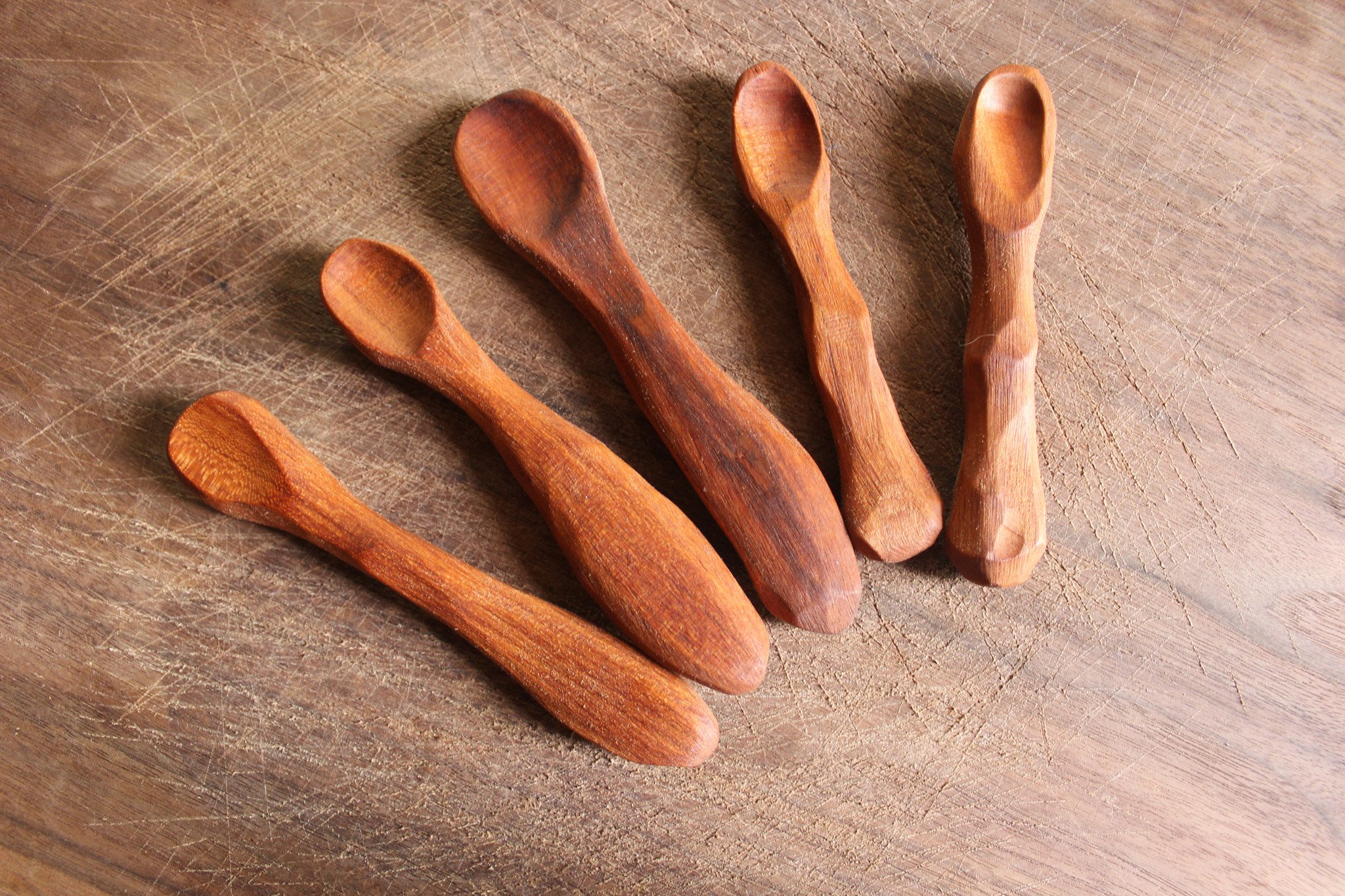 Heirloom quality wooden baby spoon, perfect for infants and adults, showcasing its smooth finish and elegant design.