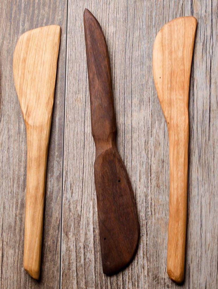 A high-quality wooden baking spatula with a short beveled blade and smooth handle, finished with organic olive oil and beeswax.