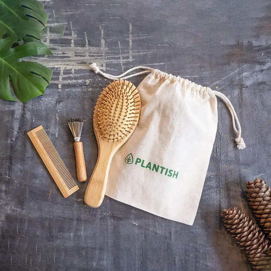 Bamboo Hair Brush Set including a round brush, bamboo comb, and brush cleaner in a reusable travel bag.