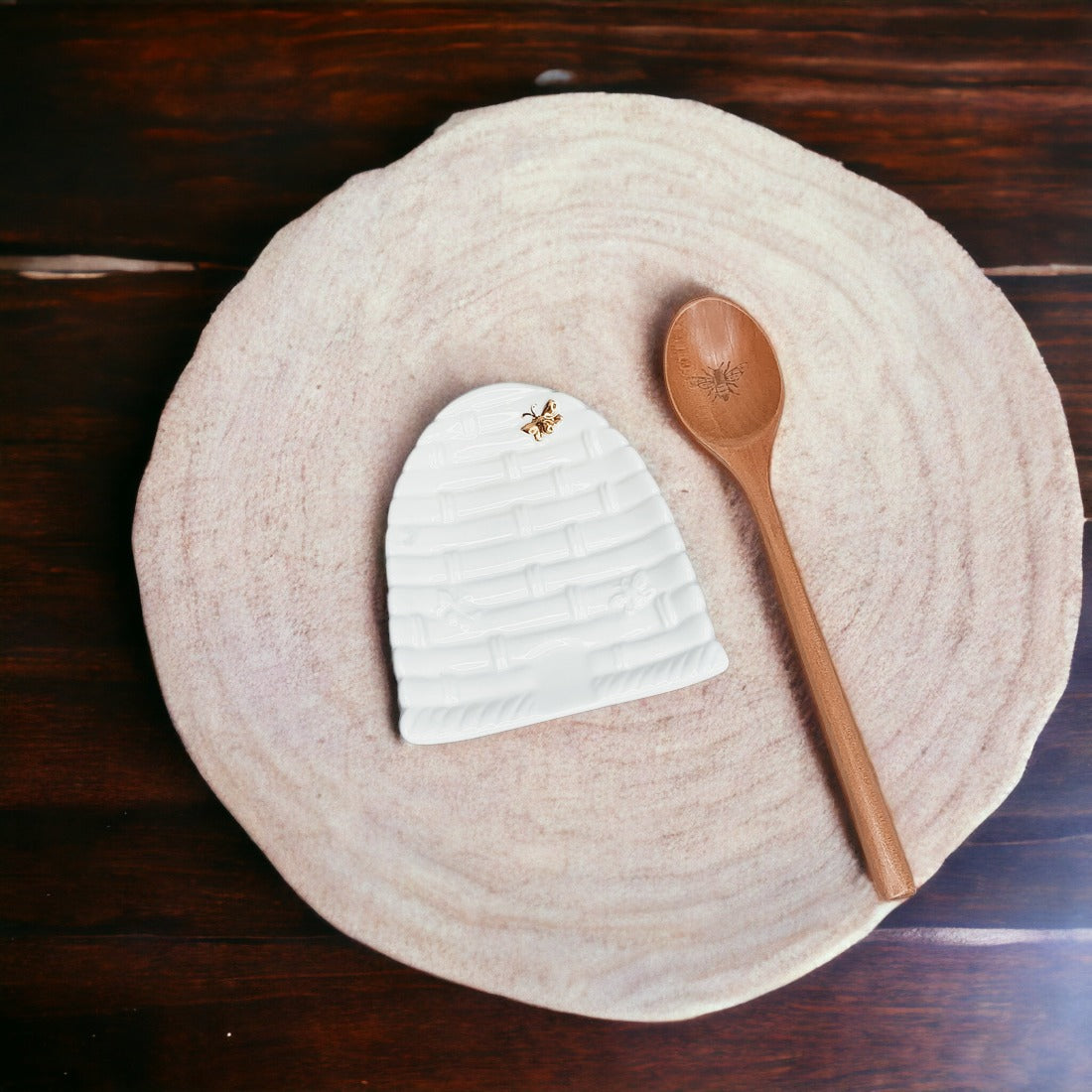 Bee Spoon Rest with a bee skep design and a wooden spoon engraved with a bee icon, perfect for bee lovers.