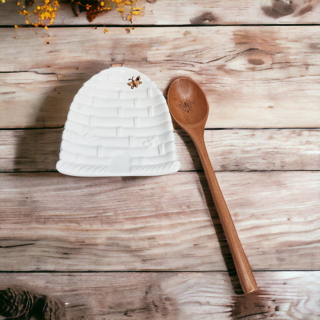 Bee Spoon Rest with a bee skep design and a wooden spoon engraved with a bee icon, perfect for bee lovers.