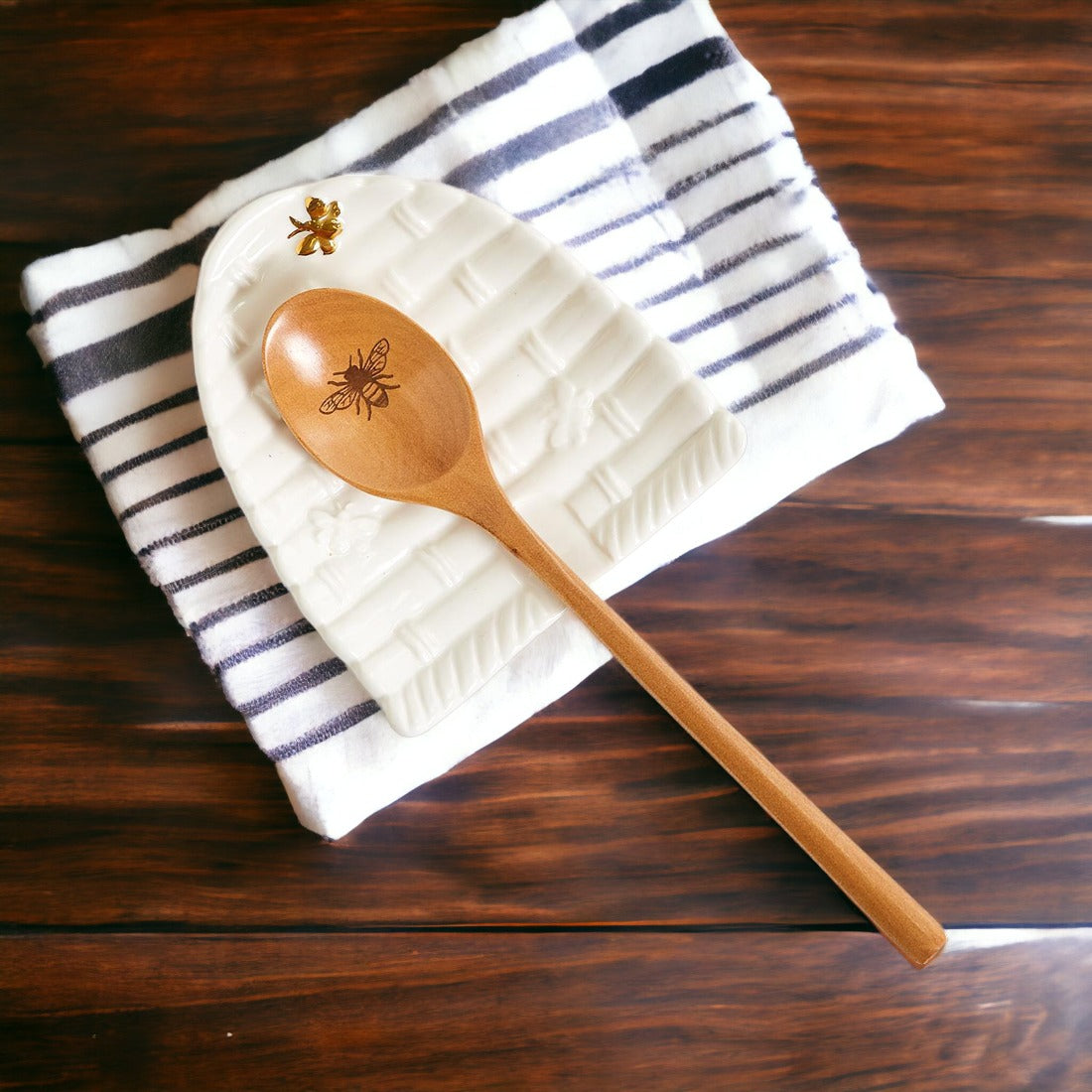 Bee Spoon Rest with a bee skep design and a wooden spoon engraved with a bee icon, perfect for bee lovers.