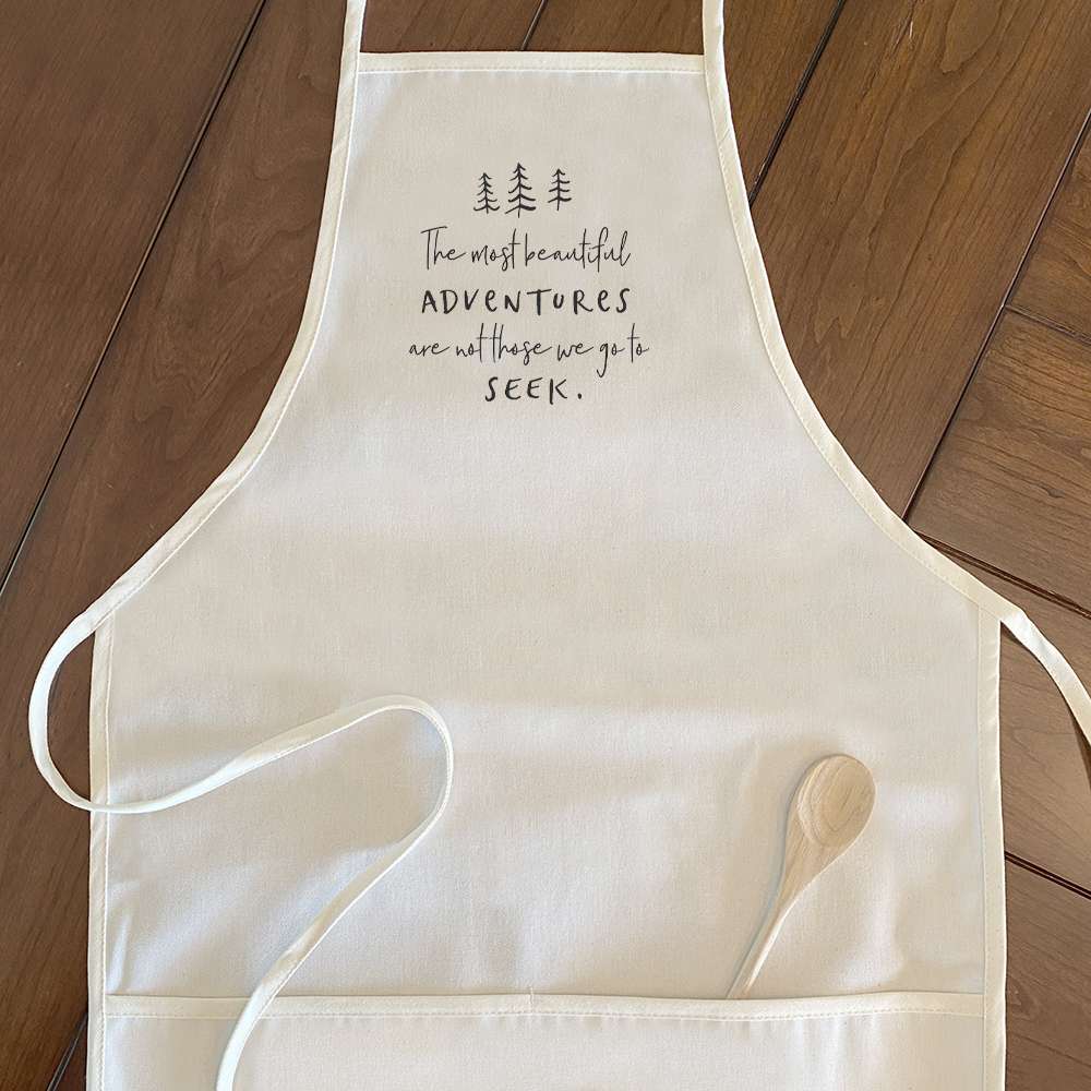 Beautiful Adventures Women's Apron featuring a tree design, made from durable cotton canvas with adjustable neck and twill ties.