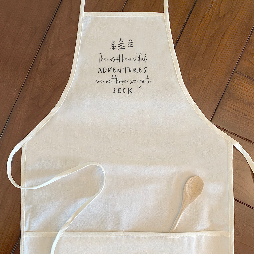 Beautiful Adventures Women's Apron featuring a tree design, made from durable cotton canvas with adjustable neck and twill ties.