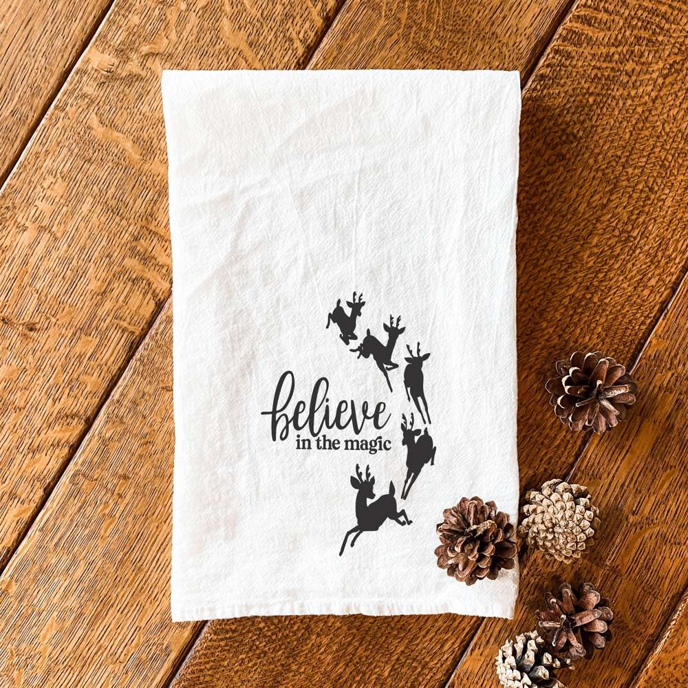 Believe in the Magic cotton tea towel featuring vibrant designs, perfect for kitchen use.