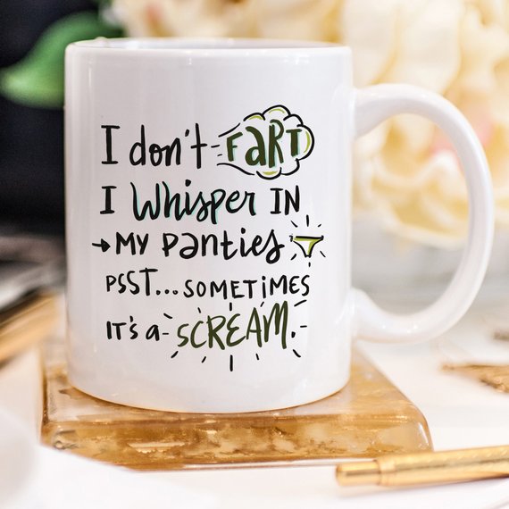 Funny coffee mug with the phrase 'I Don't Fart. I Whisper' printed on it, showcasing a humorous design perfect for gifts.