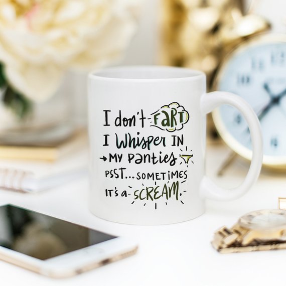 Funny coffee mug with the phrase 'I Don't Fart. I Whisper' printed on it, showcasing a humorous design perfect for gifts.