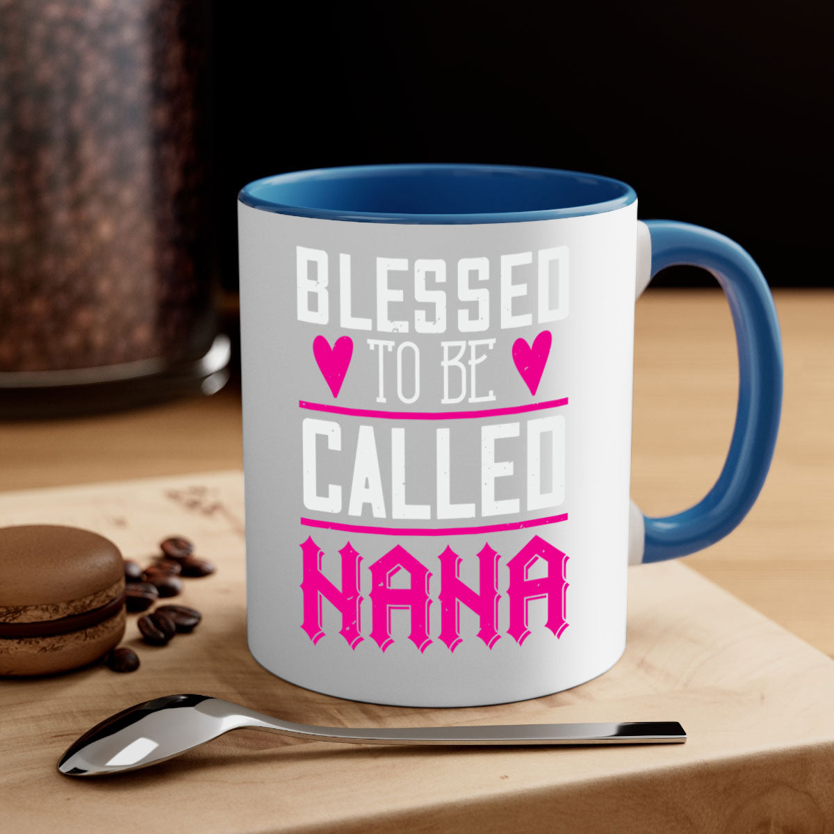 A two-tone ceramic mug with the phrase 'Blessed to be Called Nana' in elegant font, featuring a colored handle and glossy finish.