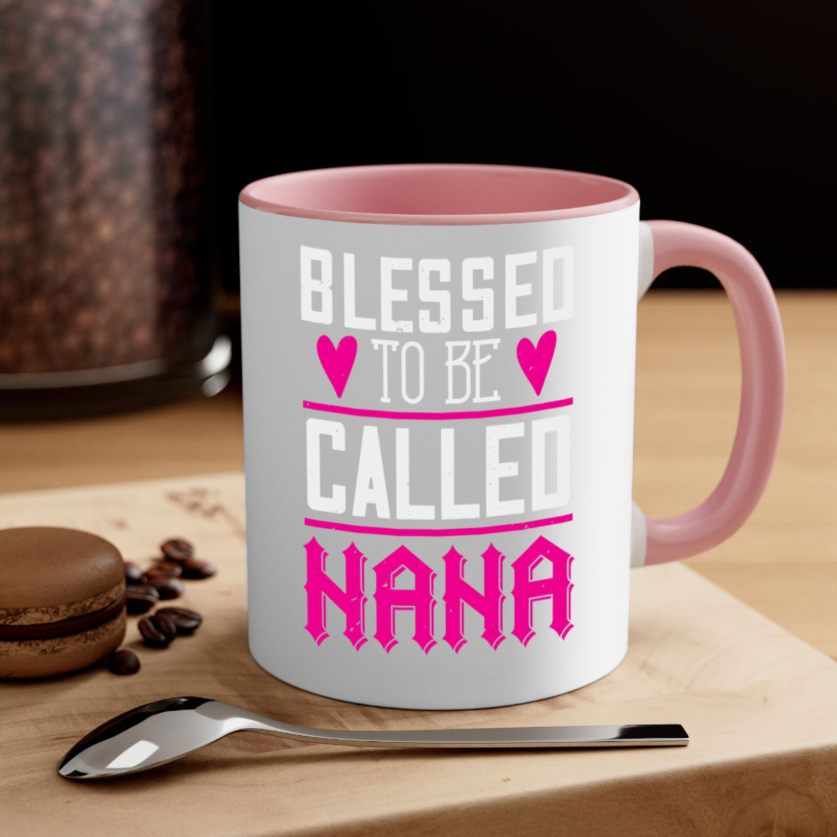 A two-tone ceramic mug with the phrase 'Blessed to be Called Nana' in elegant font, featuring a colored handle and glossy finish.