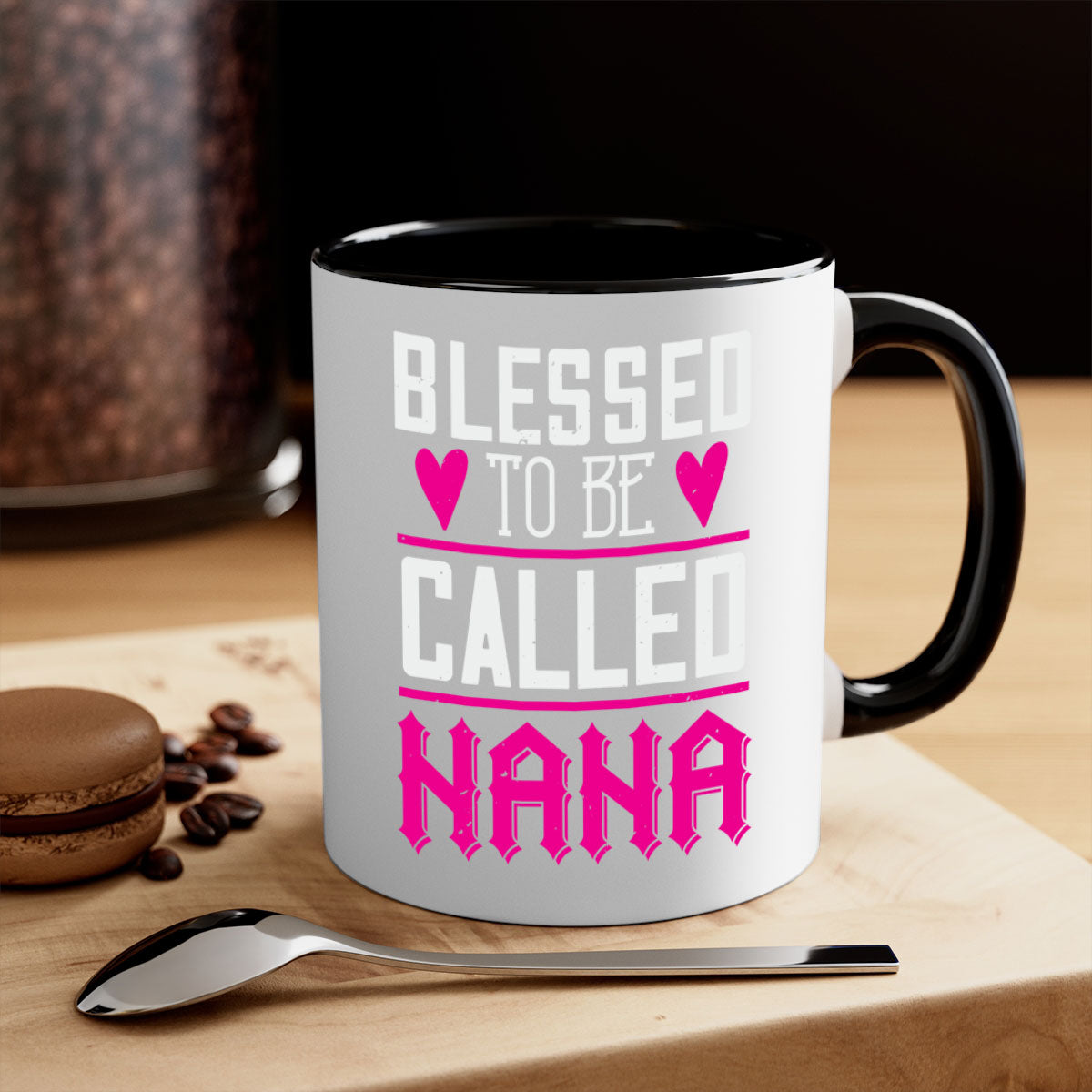 A two-tone ceramic mug with the phrase 'Blessed to be Called Nana' in elegant font, featuring a colored handle and glossy finish.