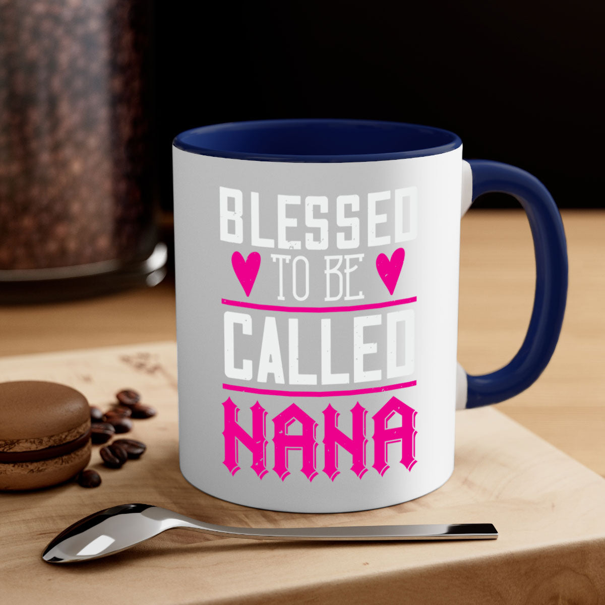 A two-tone ceramic mug with the phrase 'Blessed to be Called Nana' in elegant font, featuring a colored handle and glossy finish.