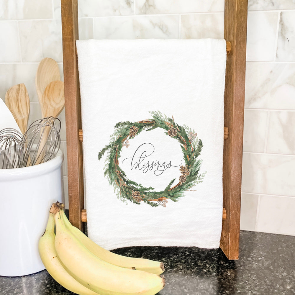 Blessings Wreath Cotton Tea Towel featuring a vibrant wreath design, made from 100% absorbent cotton, measuring 27 inches square.