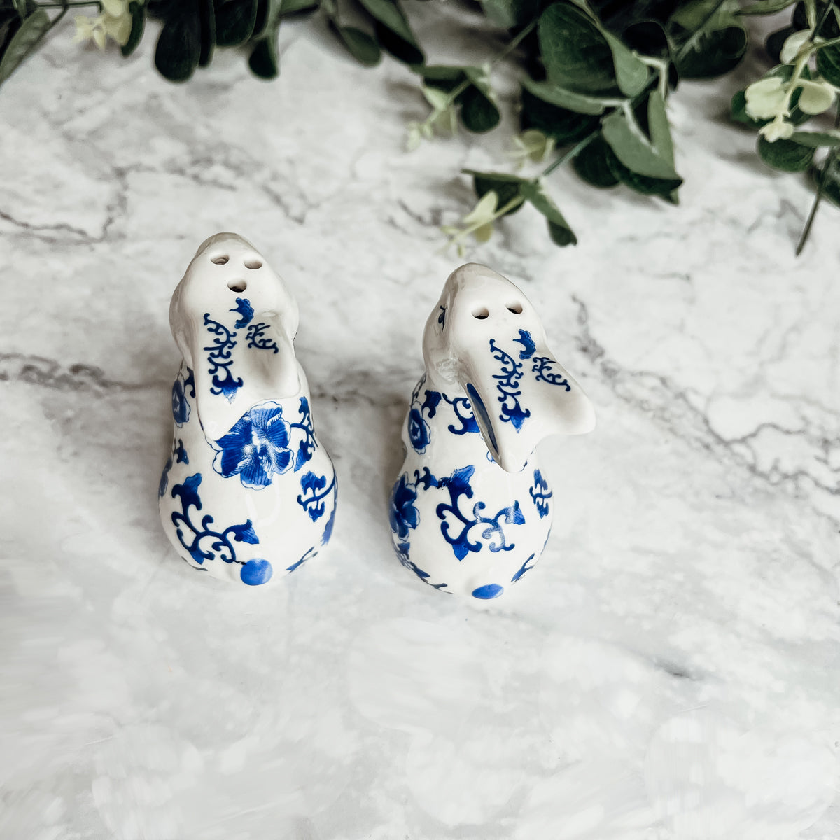 Charming blue and white bunny salt and pepper shakers, hand-painted porcelain design, perfect for spring and Easter decor.