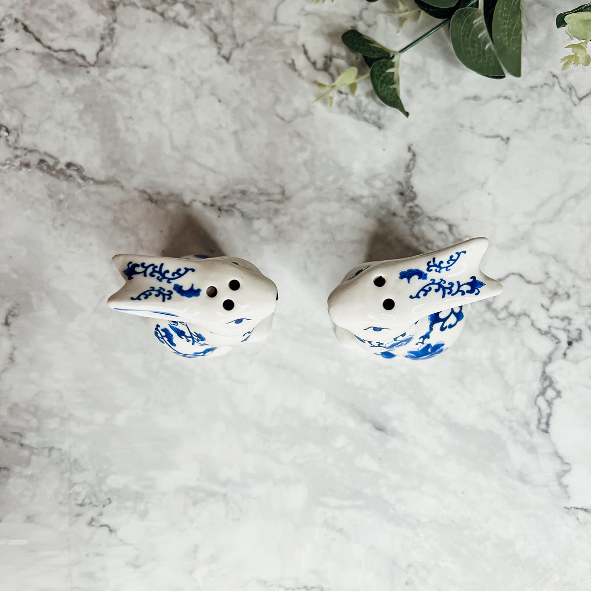 Charming blue and white bunny salt and pepper shakers, hand-painted porcelain design, perfect for spring and Easter decor.