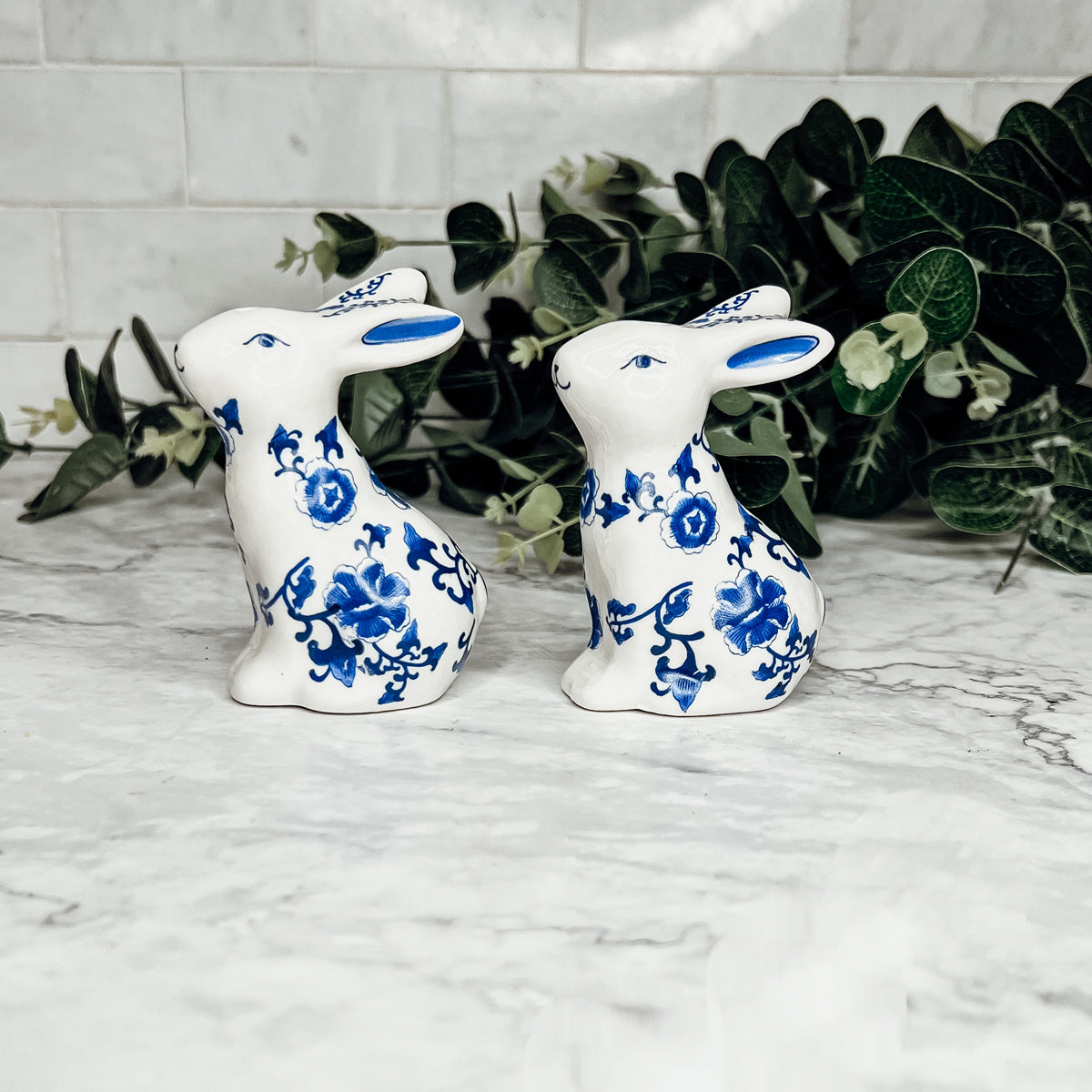 Charming blue and white bunny salt and pepper shakers, hand-painted porcelain design, perfect for spring and Easter decor.