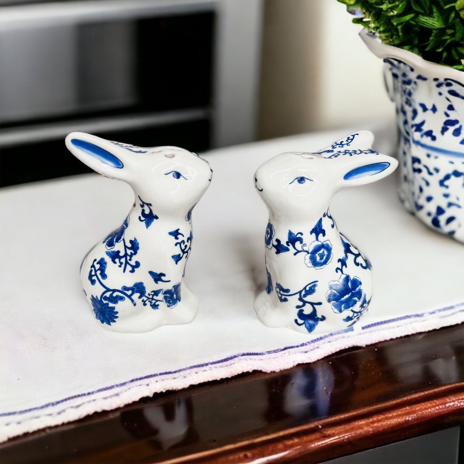 Charming blue and white bunny salt and pepper shakers, hand-painted porcelain design, perfect for spring and Easter decor.