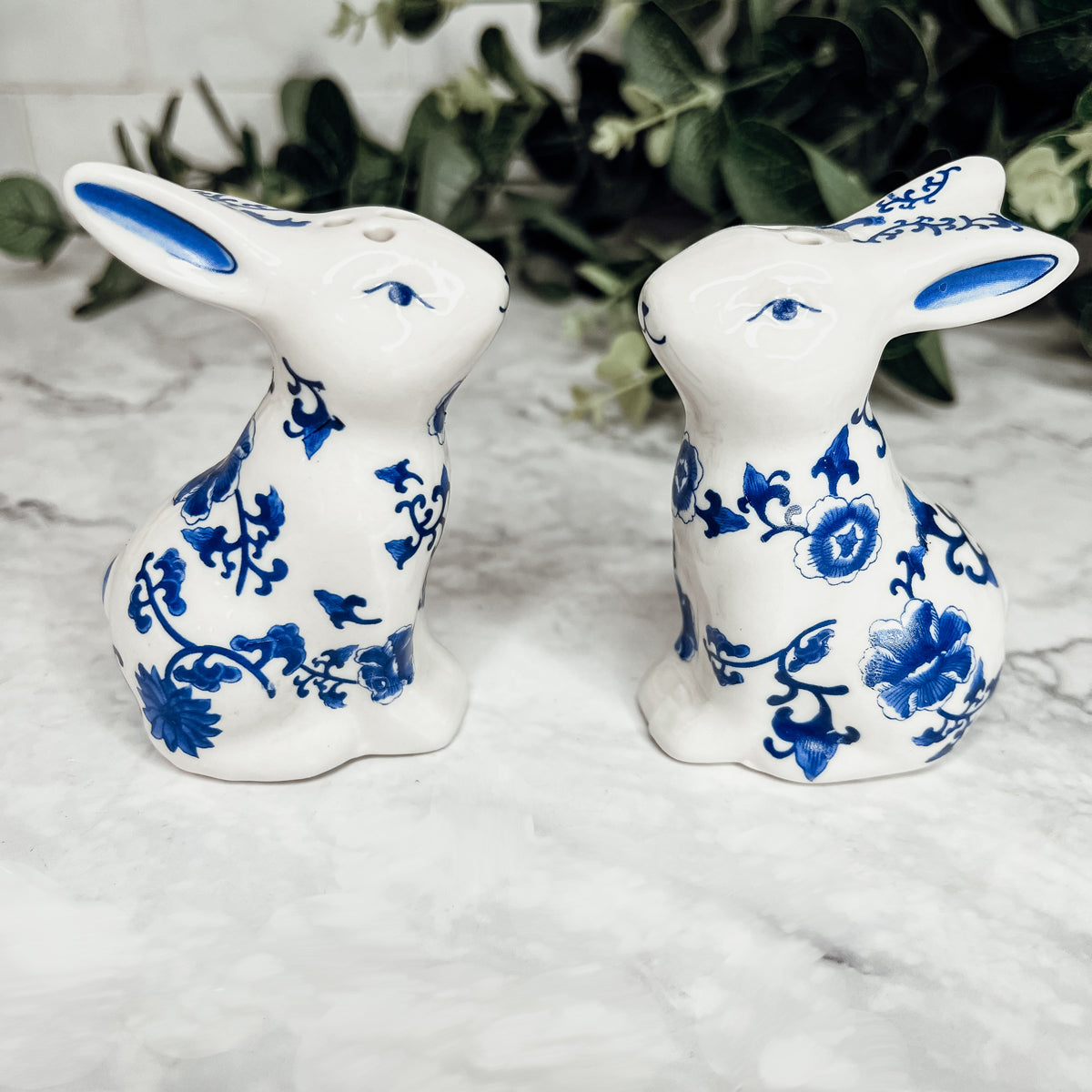 Charming blue and white bunny salt and pepper shakers, hand-painted porcelain design, perfect for spring and Easter decor.