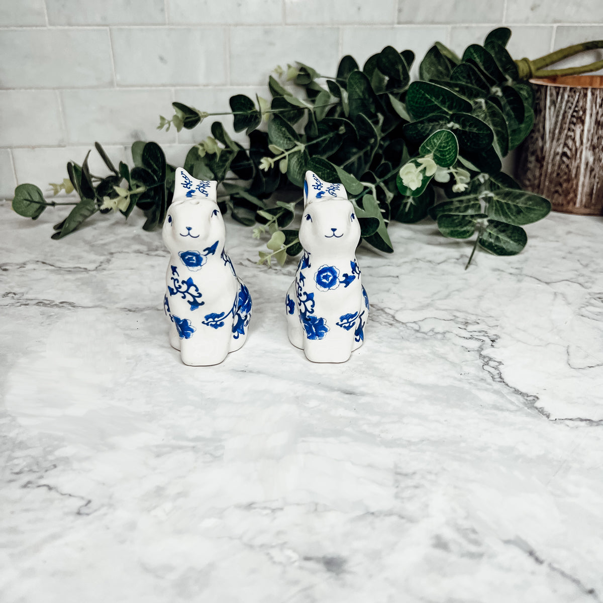 Charming blue and white bunny salt and pepper shakers, hand-painted porcelain design, perfect for spring and Easter decor.