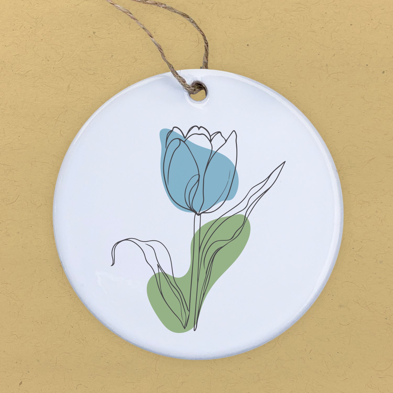 A beautiful blue hand-drawn tulip ornament made of high-quality porcelain, featuring a smooth gloss finish and vibrant design.