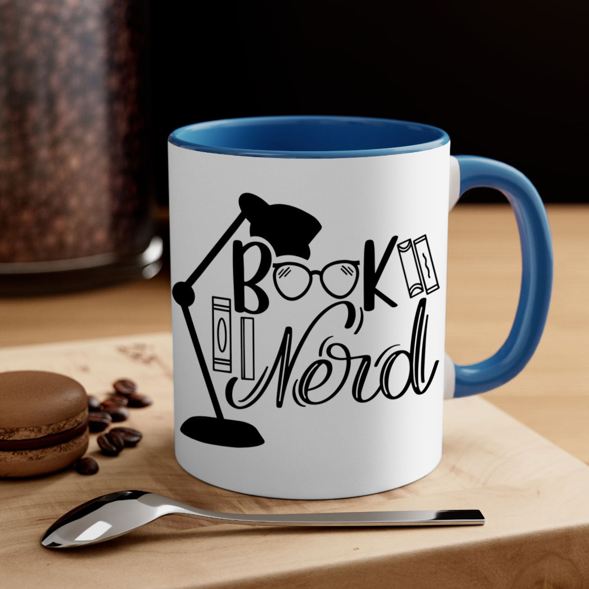 A stylish Book Nerd Mug featuring a two-tone design with a colored handle and glossy finish, perfect for coffee and tea lovers.