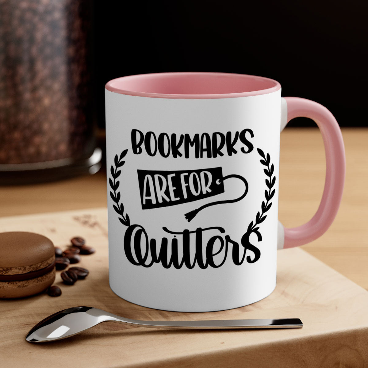 A stylish two-tone ceramic mug with the phrase 'Bookmarks Are for Quitters', featuring a colored handle and glossy finish.