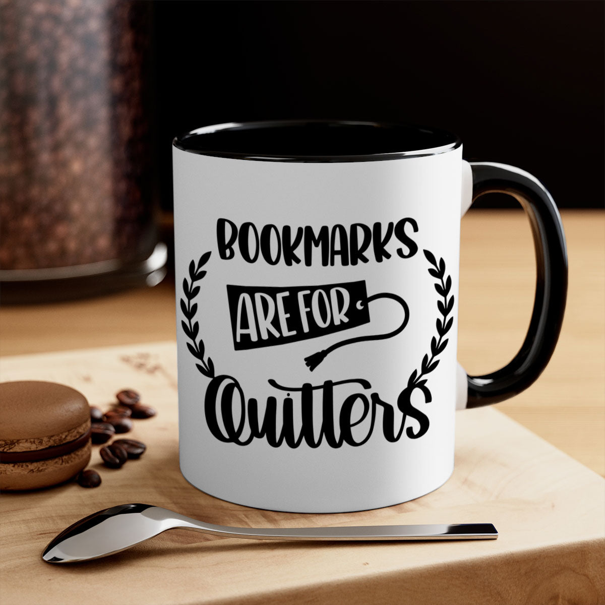 A stylish two-tone ceramic mug with the phrase 'Bookmarks Are for Quitters', featuring a colored handle and glossy finish.