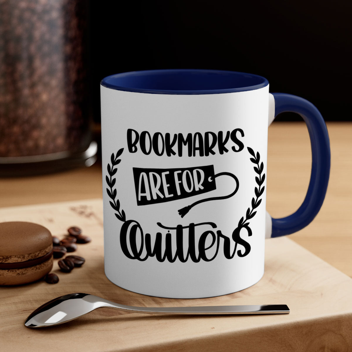 A stylish two-tone ceramic mug with the phrase 'Bookmarks Are for Quitters', featuring a colored handle and glossy finish.