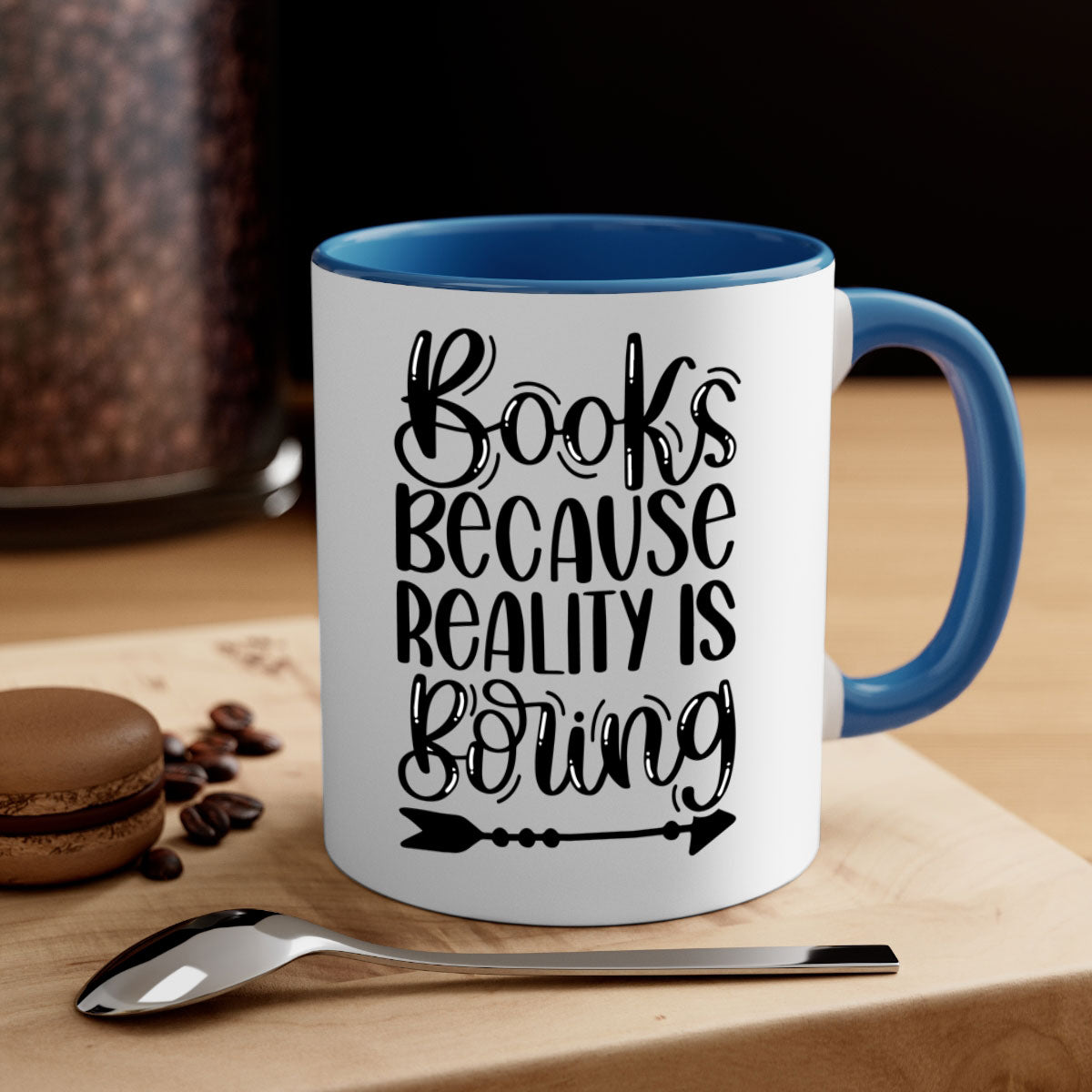 A stylish two-tone ceramic mug with the phrase 'Books Because Reality is Boring', featuring a colored handle and glossy finish.