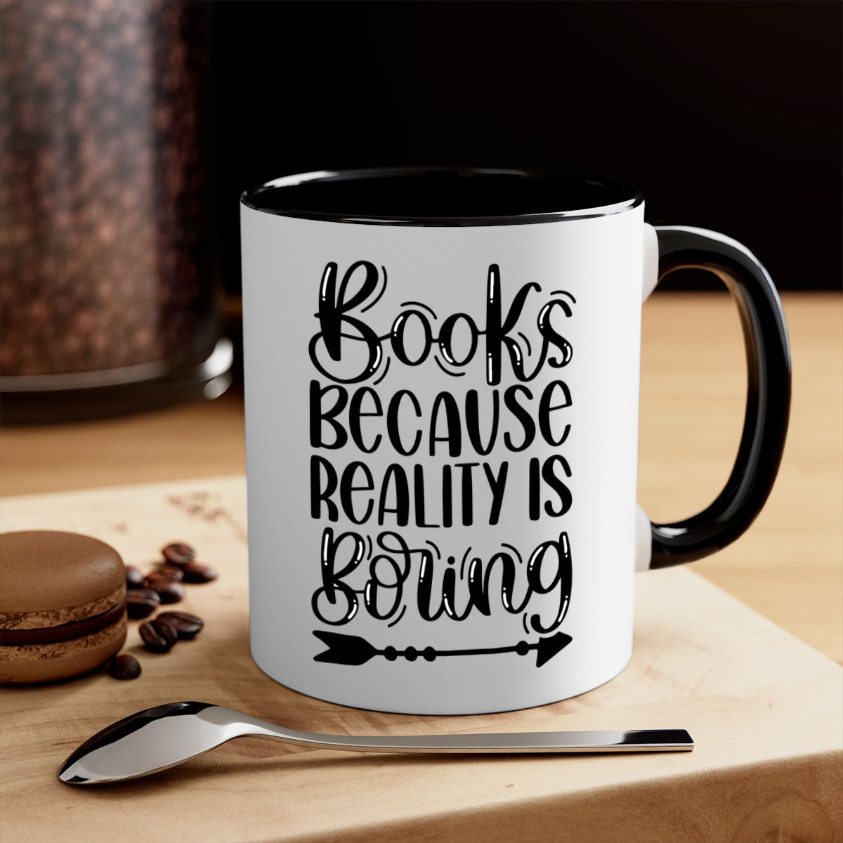 A stylish two-tone ceramic mug with the phrase 'Books Because Reality is Boring', featuring a colored handle and glossy finish.