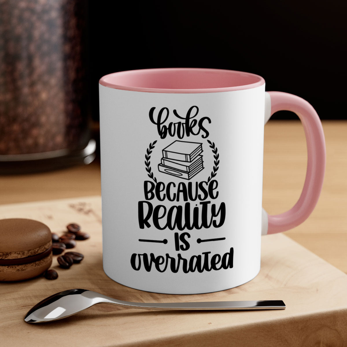 A two-tone ceramic mug with the phrase 'Books Because Reality is Overrated' printed on it, featuring a colored handle and glossy finish.