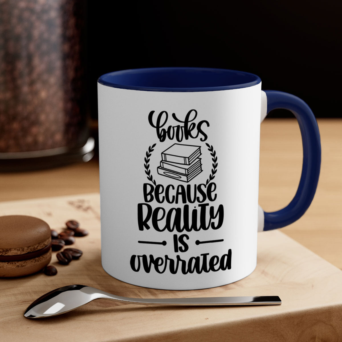 A two-tone ceramic mug with the phrase 'Books Because Reality is Overrated' printed on it, featuring a colored handle and glossy finish.