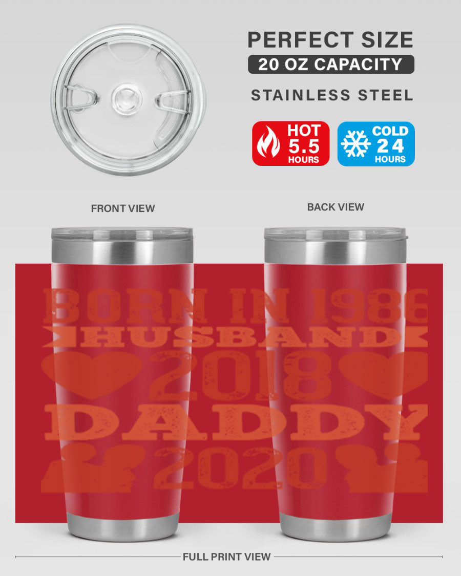 A stylish 'Born in Husband Daddy' tumbler in stainless steel, showcasing its double wall vacuum design and drink-thru lid.