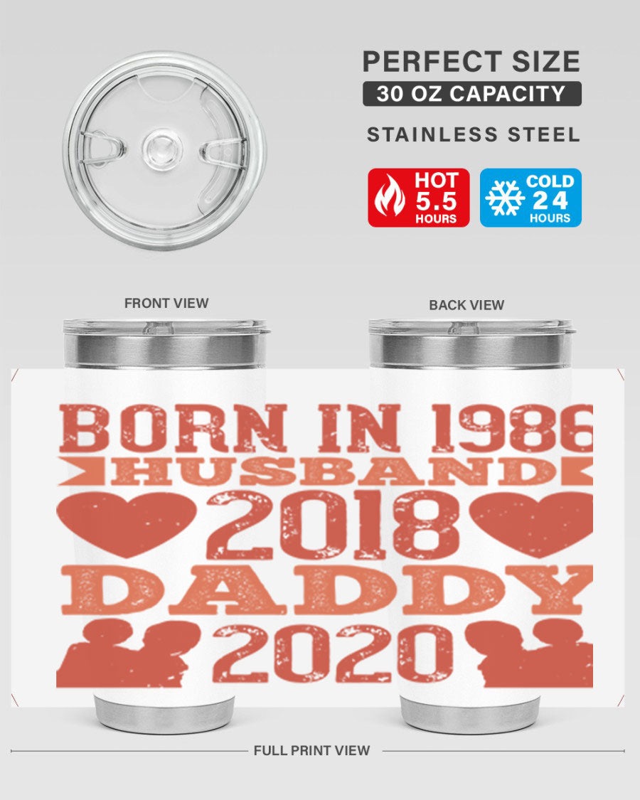 A stylish 'Born in Husband Daddy' tumbler in stainless steel, showcasing its double wall vacuum design and drink-thru lid.