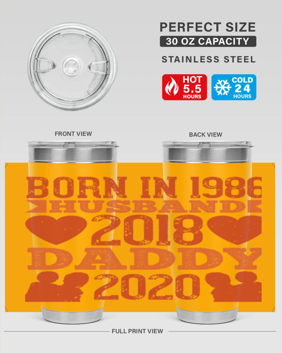 A stylish 'Born in Husband Daddy' tumbler in stainless steel, showcasing its double wall vacuum design and drink-thru lid.