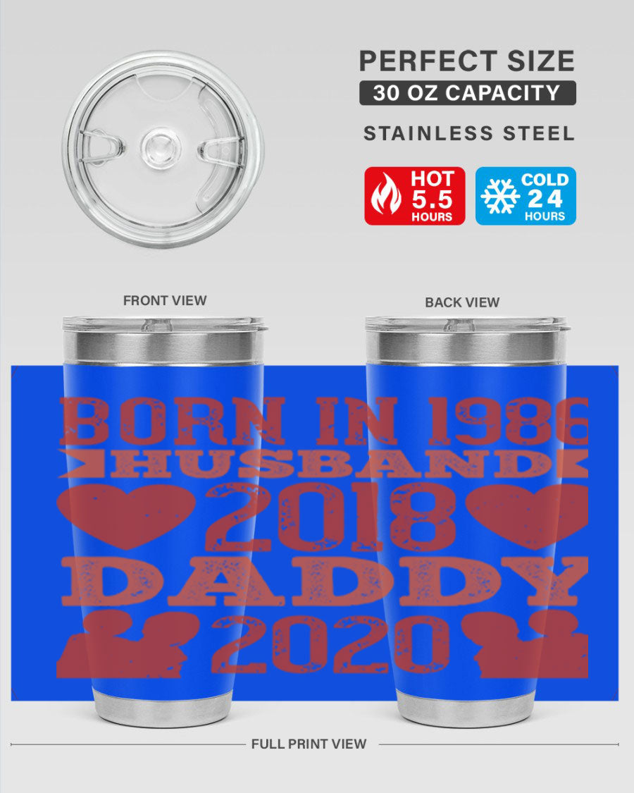 A stylish 'Born in Husband Daddy' tumbler in stainless steel, showcasing its double wall vacuum design and drink-thru lid.