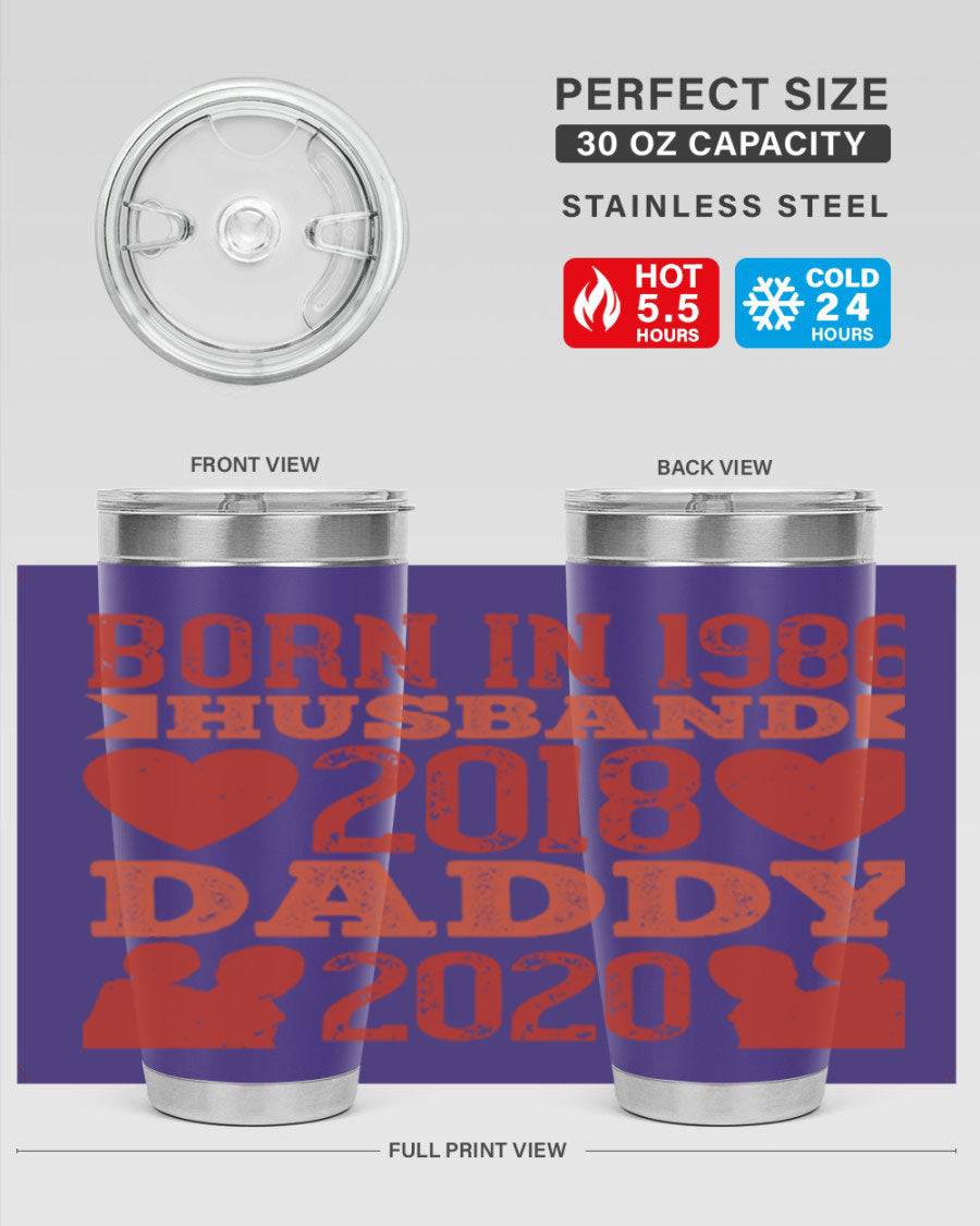 A stylish 'Born in Husband Daddy' tumbler in stainless steel, showcasing its double wall vacuum design and drink-thru lid.