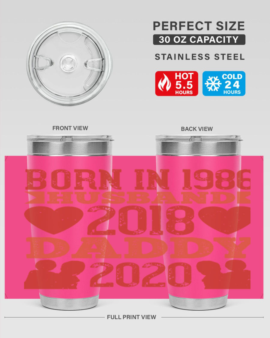 A stylish 'Born in Husband Daddy' tumbler in stainless steel, showcasing its double wall vacuum design and drink-thru lid.