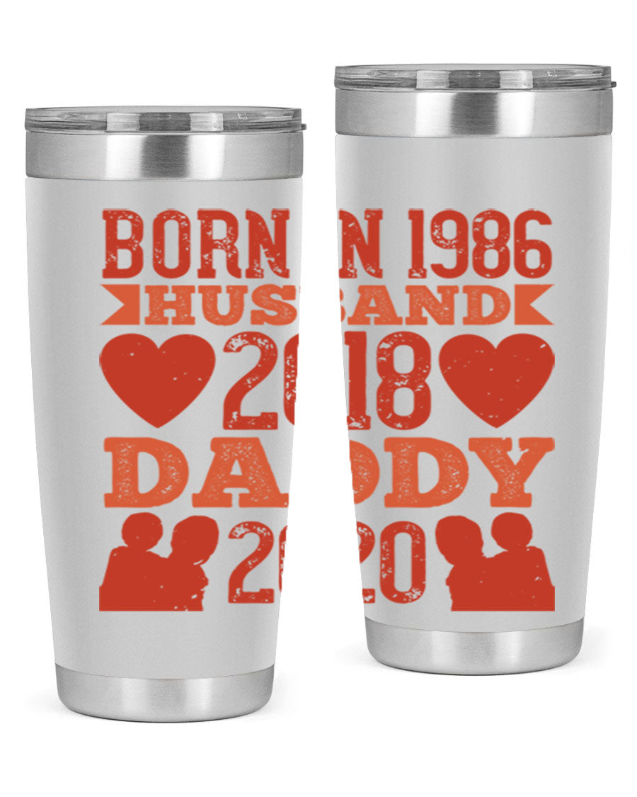 A stylish 'Born in Husband Daddy' tumbler in stainless steel, showcasing its double wall vacuum design and drink-thru lid.