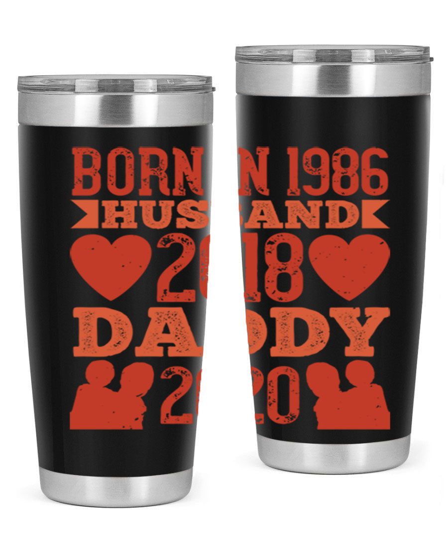 A stylish 'Born in Husband Daddy' tumbler in stainless steel, showcasing its double wall vacuum design and drink-thru lid.