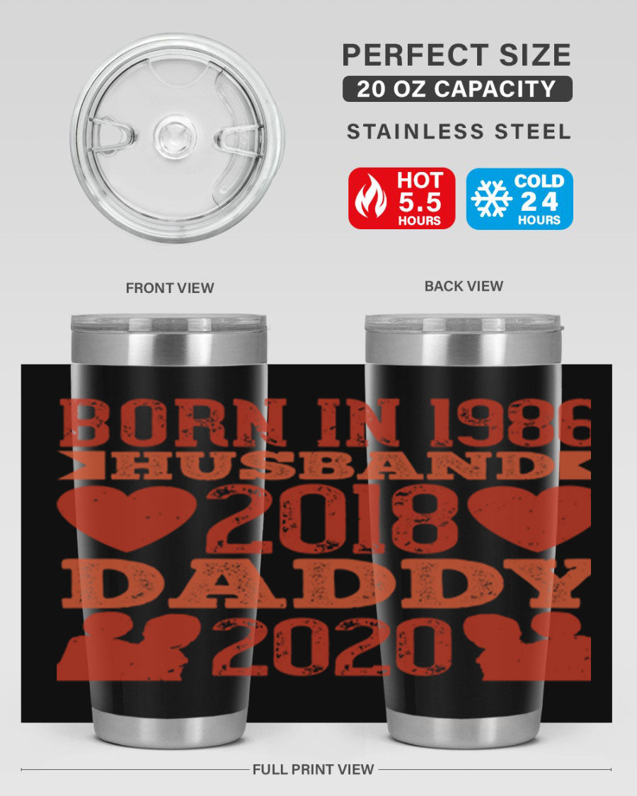 A stylish 'Born in Husband Daddy' tumbler in stainless steel, showcasing its double wall vacuum design and drink-thru lid.