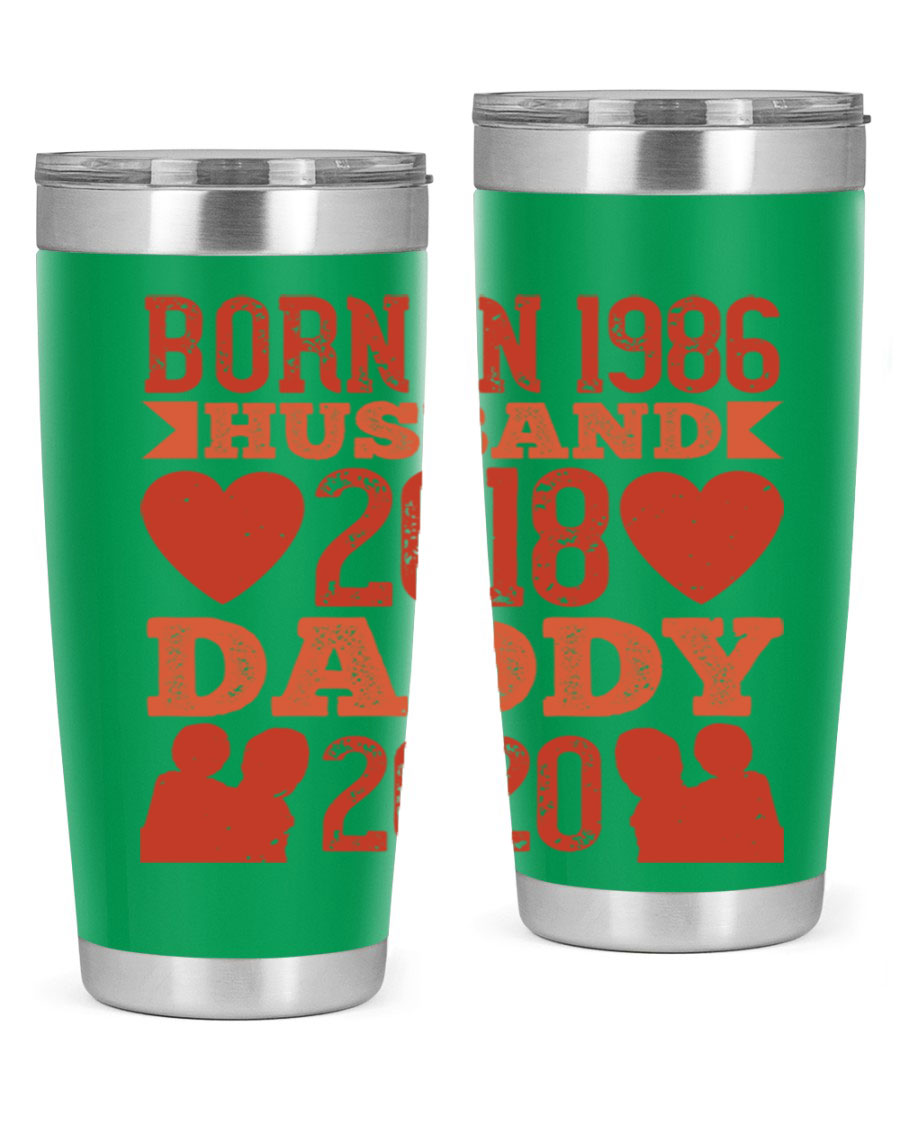 A stylish 'Born in Husband Daddy' tumbler in stainless steel, showcasing its double wall vacuum design and drink-thru lid.