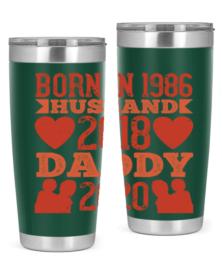 A stylish 'Born in Husband Daddy' tumbler in stainless steel, showcasing its double wall vacuum design and drink-thru lid.